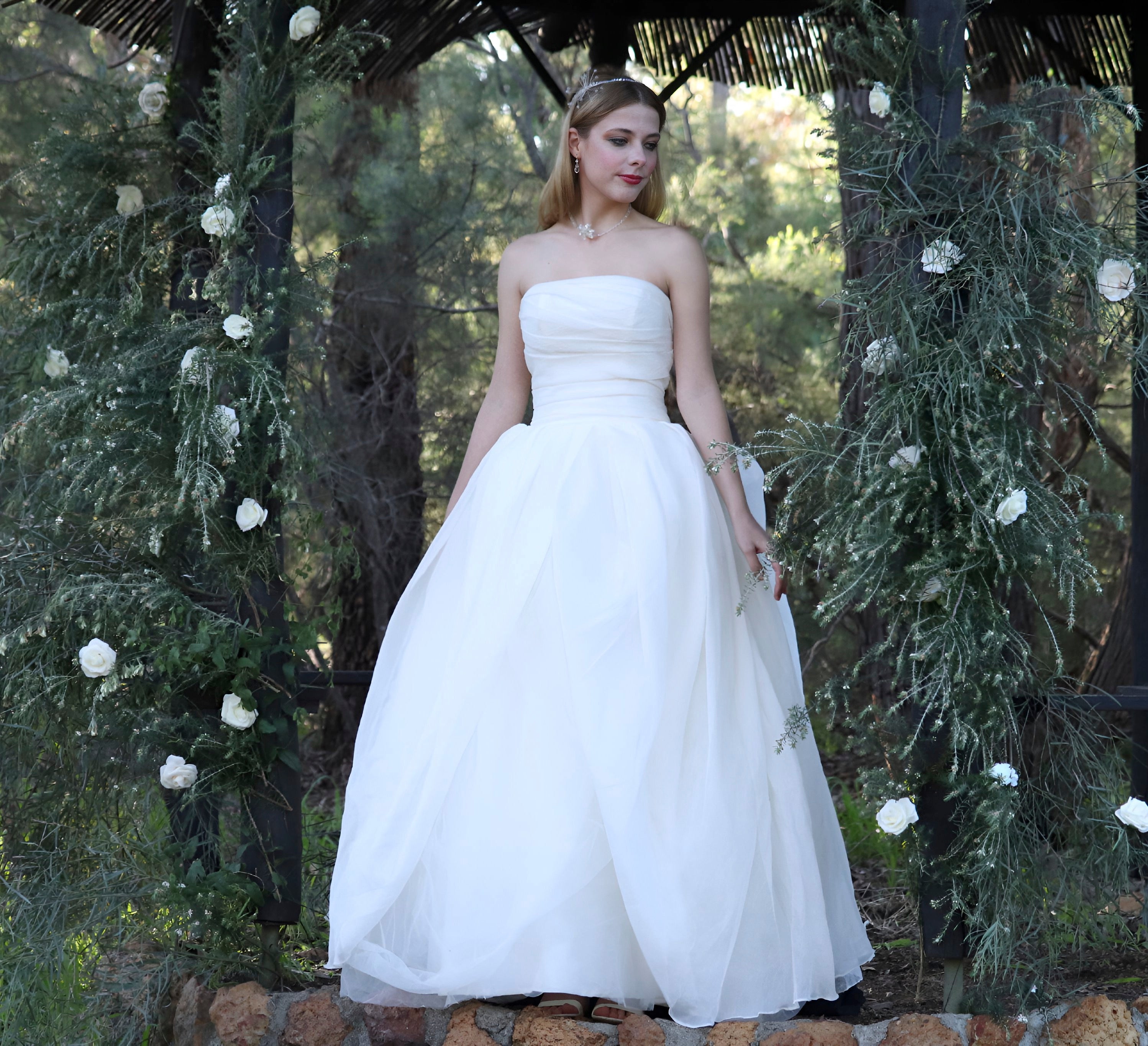 Silky soft delicate work of art. Finely boned bodice, with a full bodied beautifully layered flowing romantic buttery soft skirt. A sensational silky showstopper by Vera Wang.