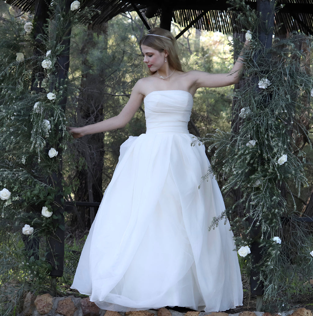 Silky soft delicate work of art. Finely boned bodice, with a full bodied beautifully layered flowing romantic buttery soft skirt. A sensational silky showstopper by Vera Wang.