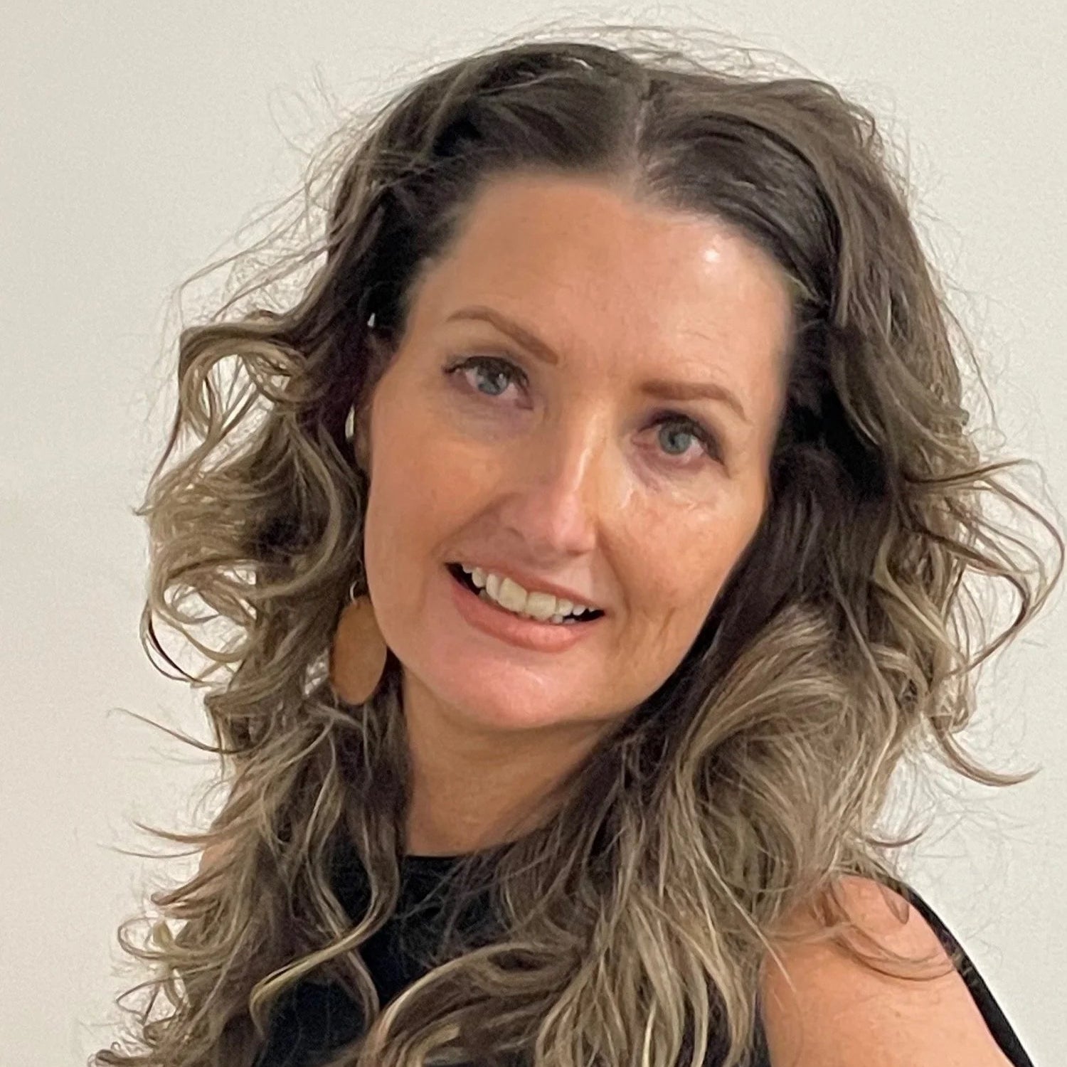 Angela owner of the Within Reach bridal studio with wedding dress in the Perth hills