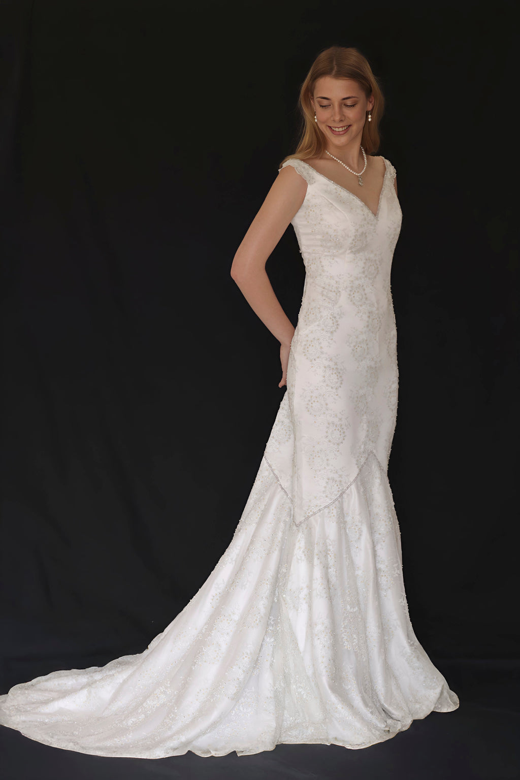 Demetrios wedding dress hire Perth with botanical lace, plunging neckline, and softly fitted skirt, fits AU6-8