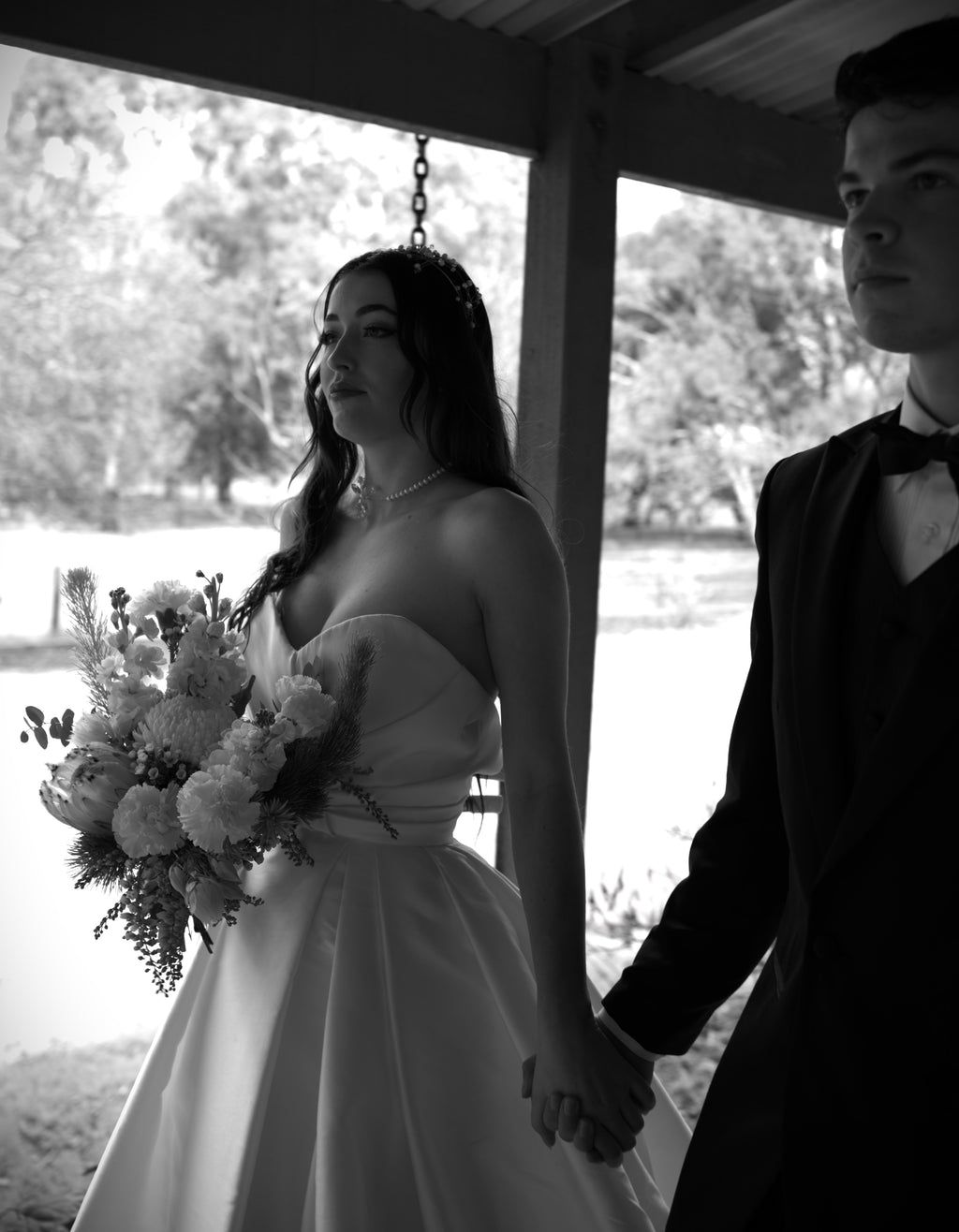 Reem Acra wedding dress hire Perth – ruched corseted bodice with dramatic full skirt and side slit, fits AU4-8