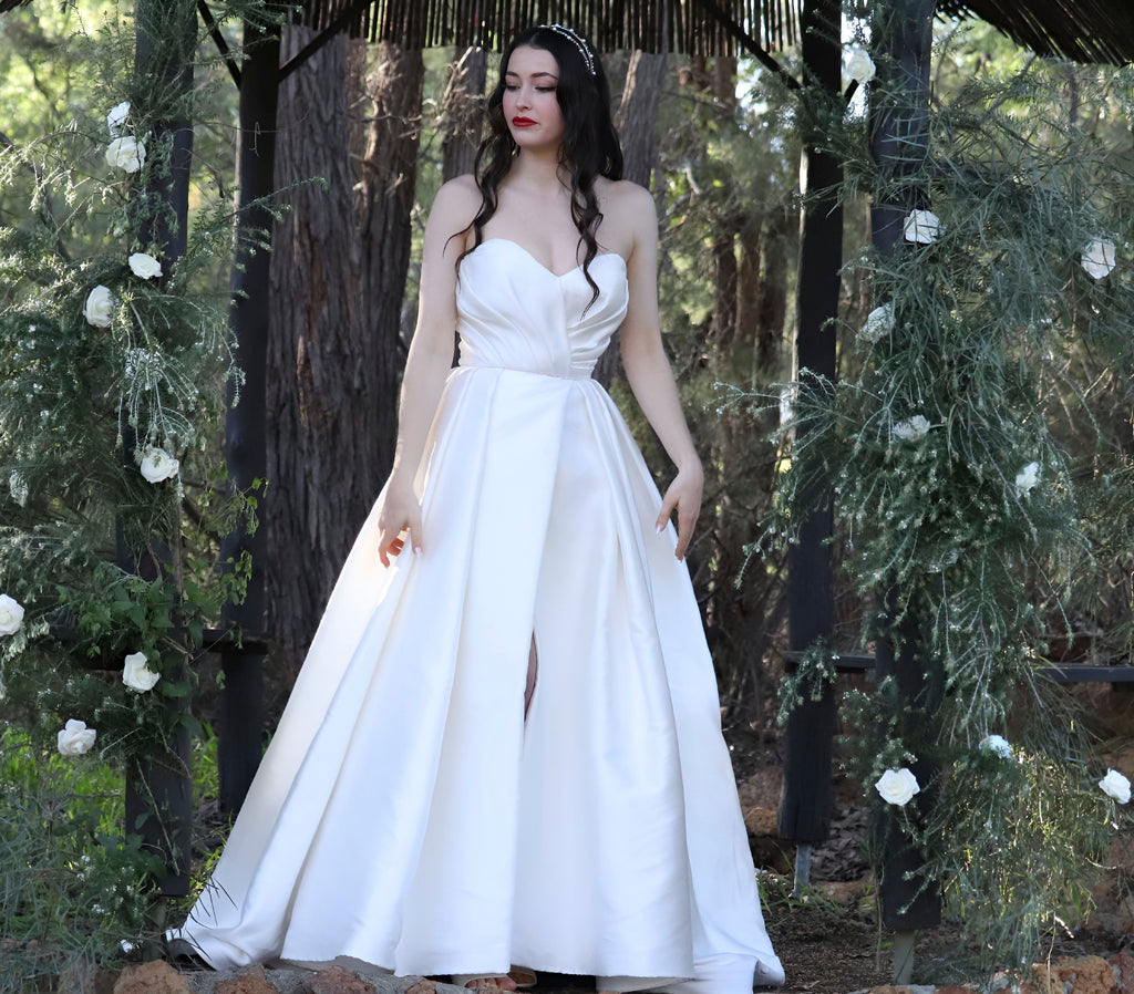 Reem Acra wedding dress hire Perth – ruched corseted bodice with dramatic full skirt and side slit, fits AU4-8